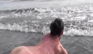 Hot brunette hair sex bomb does undressed yoga on a gorgeous beach